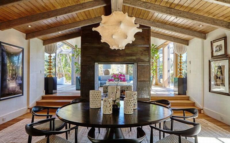 Rustic dining room with vaulted wood ceilings and warm natural finishes inside a private Malibu estate.