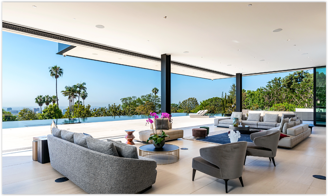 Modern private estate home for luxury events featuring seamless indoor-outdoor living, an infinity-edge pool, designer furnishings, and panoramic Los Angeles views.