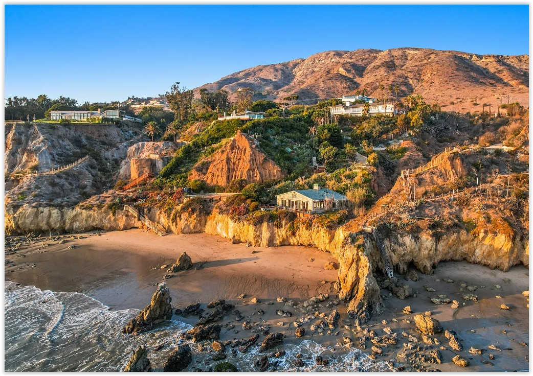 Guest cottage nestled among landscaped gardens at an elegant Malibu private estate.