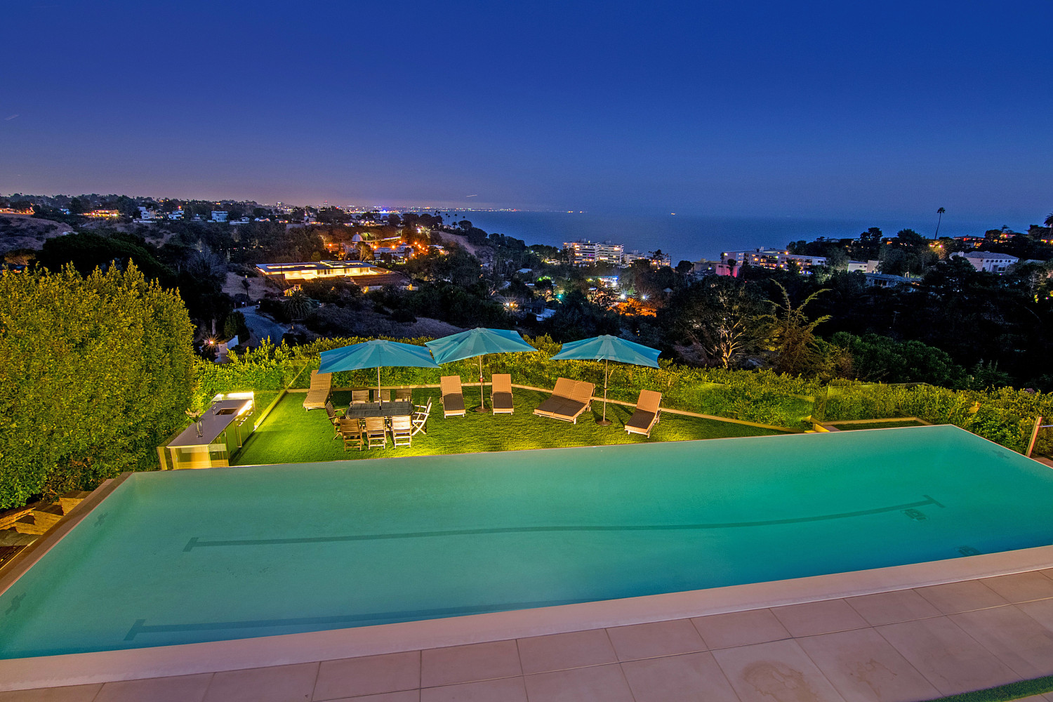Resort-style swimming pool at the Modern Pacific Palisades Event Estate overlooking the Pacific Ocean