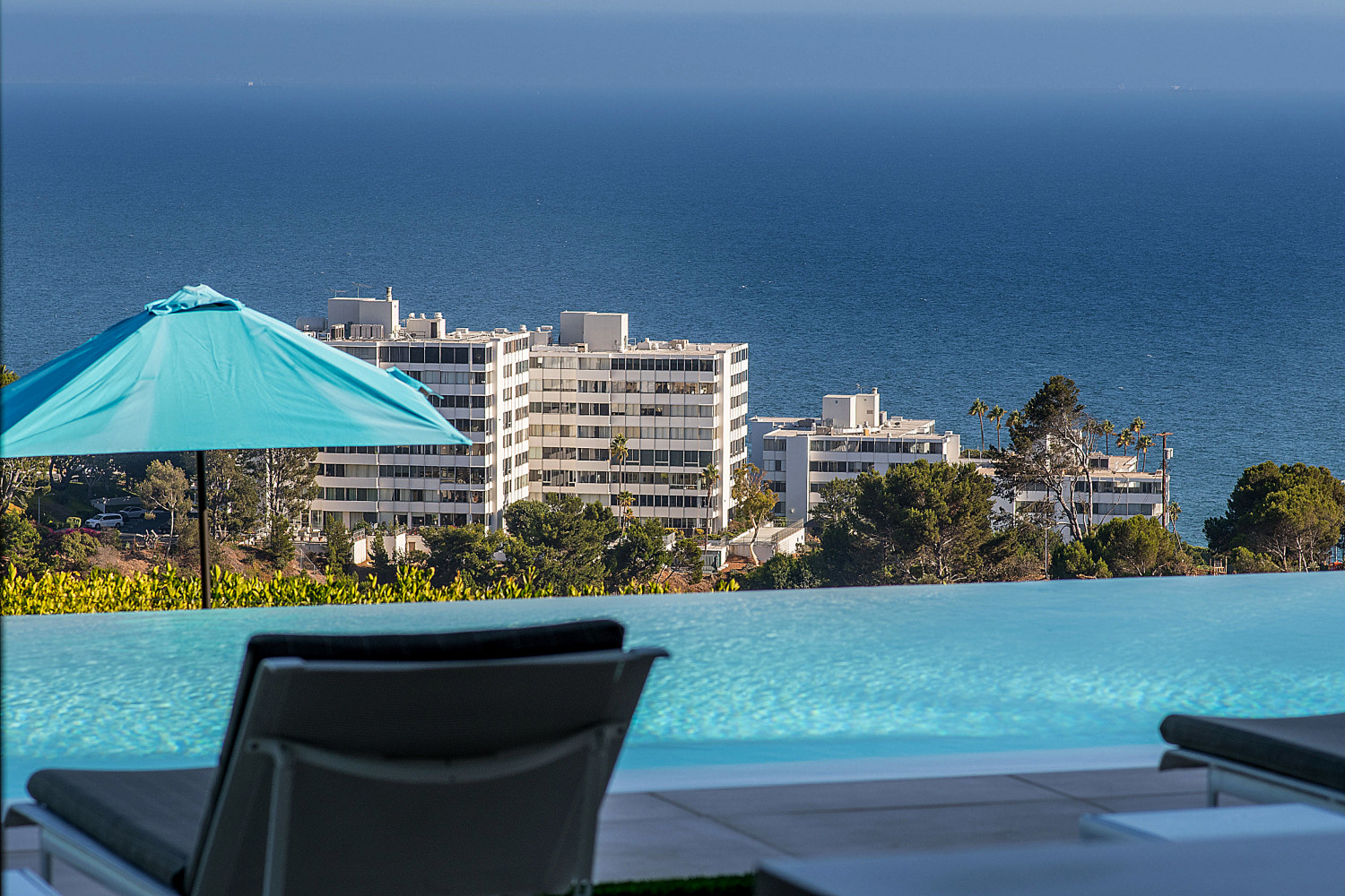 Resort-style swimming pool at the Modern Pacific Palisades Event Estate overlooking the Pacific Ocean