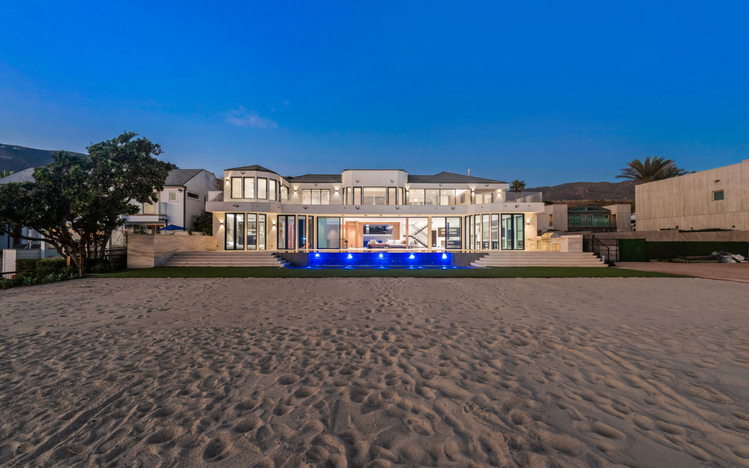 Modern Malibu beachfront estate with direct beach access and panoramic Pacific Ocean views.
