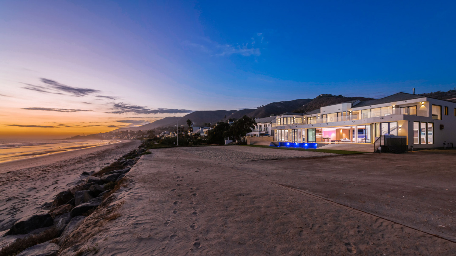 Modern Malibu beachfront estate with direct beach access and panoramic Pacific Ocean views.
