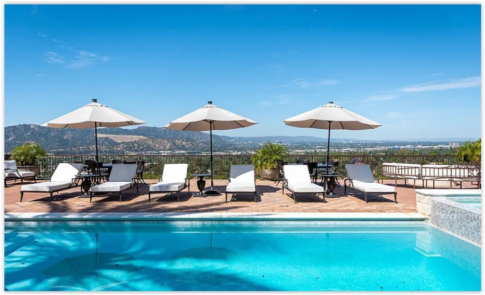 Luxury swimming pool overlooking panoramic Glendale city and mountain views.