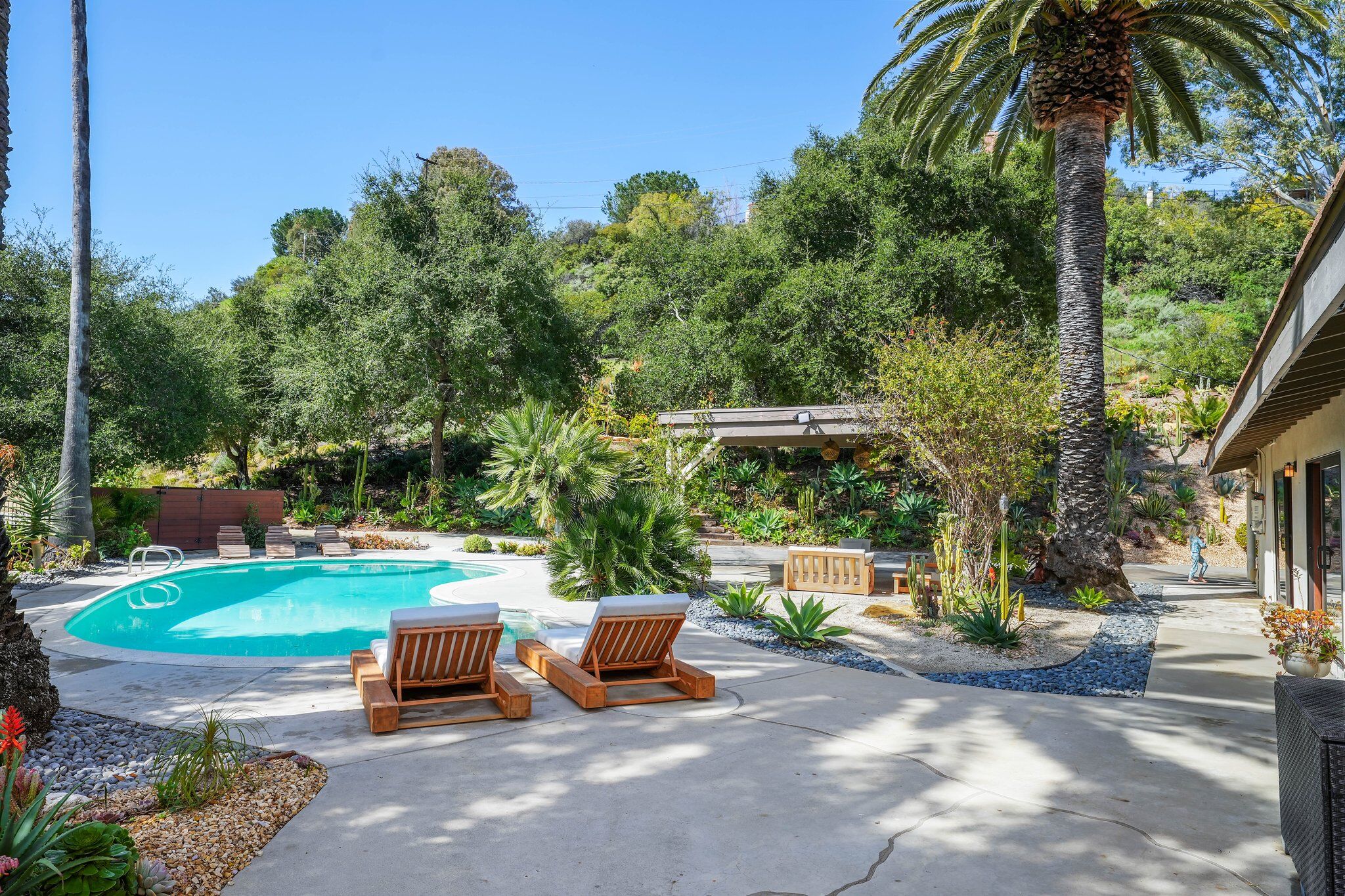 Private pool in the Calabasas hills with a spacious entertaining deck and scenic mountain views.