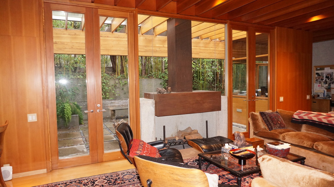 Warm living room with fireplace at the John Lautner estate