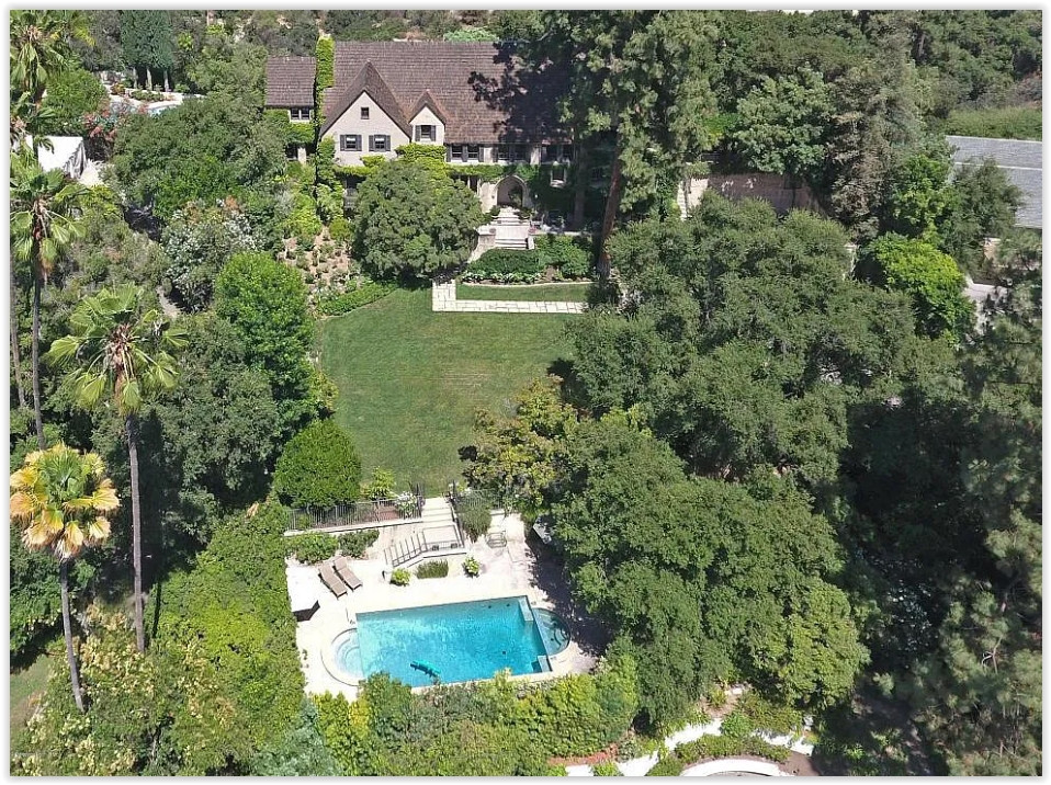 Aerial view of a private Pasadena estate showcasing the residence, gardens, and swimming pool.