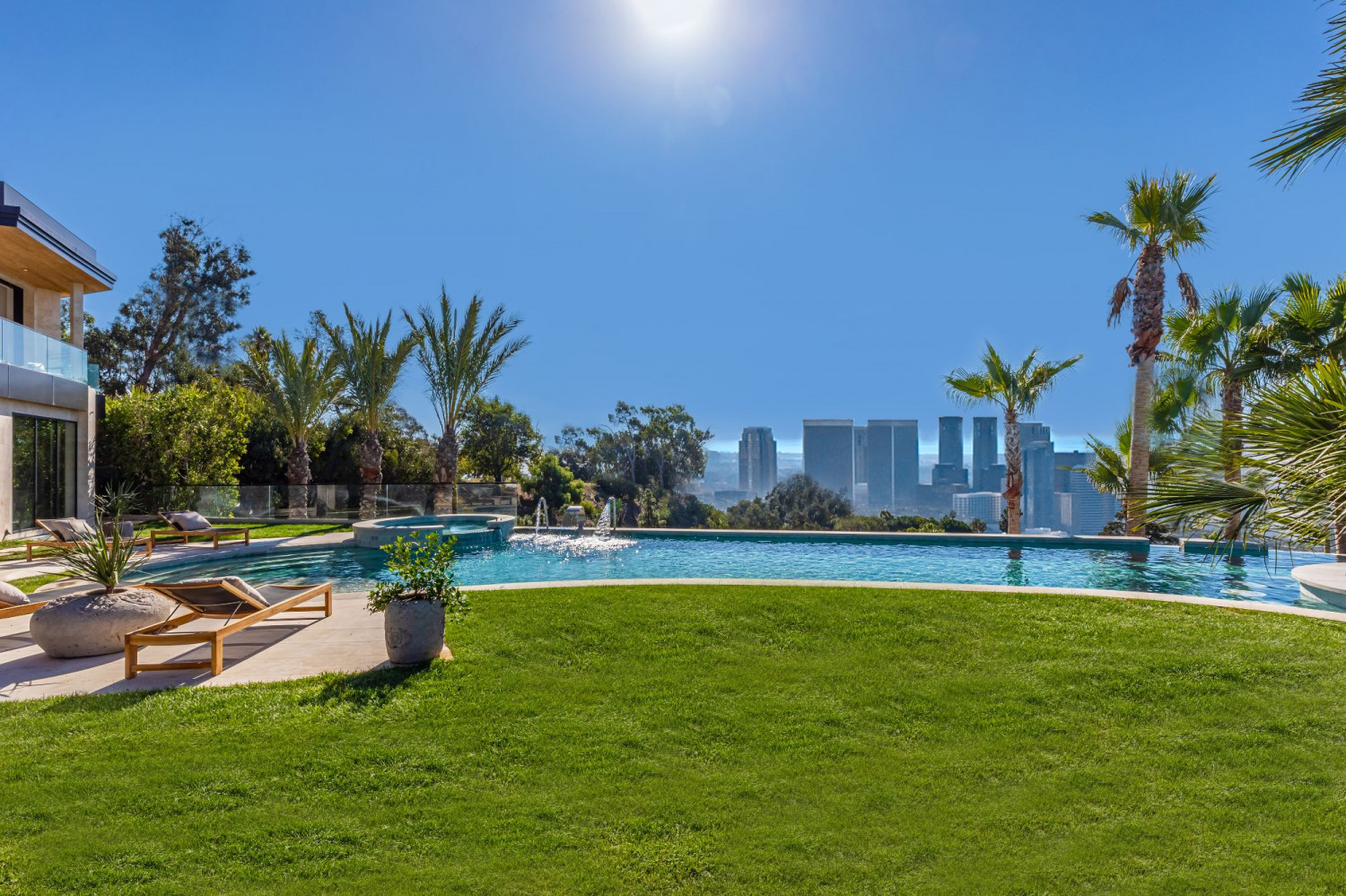 Infinity-style pool overlooking the Beverly Hills skyline with panoramic city views and luxury outdoor entertaining spaces.