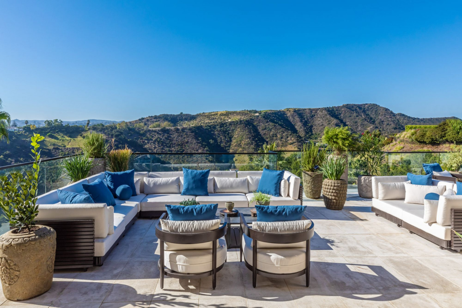 Outdoor lounge terrace with panoramic canyon views and designer seating at a contemporary Beverly Hills private event estate.