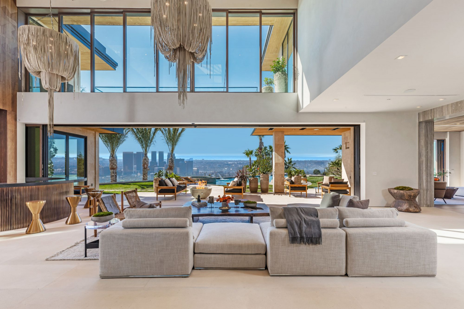Bright contemporary great room with floor-to-ceiling windows overlooking Beverly Hills.