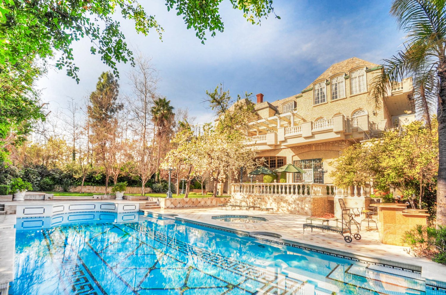 Resort-style swimming pool and outdoor entertaining terrace at a luxury Beverly Hills estate rental | D645-BH