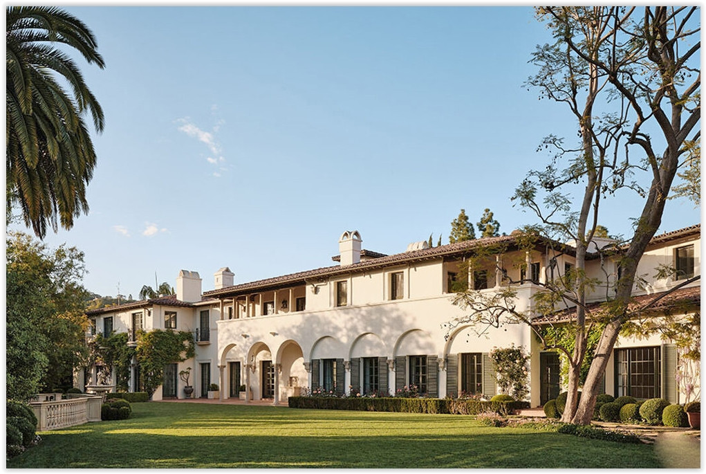 Bel Air Mediterranean estate overlooking a manicured lawn with arched architecture