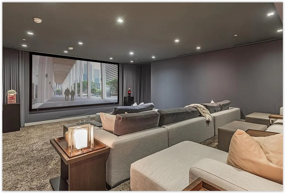 Private screening room with oversized seating and contemporary interior design