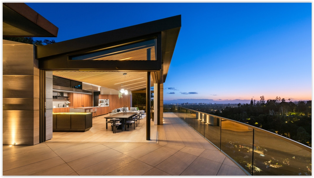 Indoor-outdoor dining area at D804-BH overlooking Los Angeles at dusk