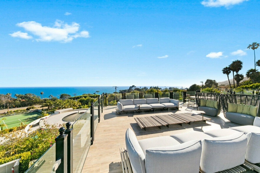 Outdoor lounge terrace overlooking the Pacific Ocean at a Malibu estate